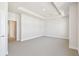 Bright bedroom with a tray ceiling, carpet, and ensuite bathroom at 7266 Kodiak Ln, Sarasota, FL 34240