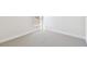 Neutral bedroom featuring carpeting, baseboards, and a window for natural light at 7266 Kodiak Ln, Sarasota, FL 34240