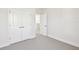 Neutral carpeted bedroom with double doors, interior door, and modern trim at 7266 Kodiak Ln, Sarasota, FL 34240