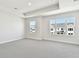 Light-filled bedroom featuring large windows with a view of the neighborhood at 7266 Kodiak Ln, Sarasota, FL 34240