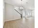 Open concept living room features wood floors, modern lighting, and bright windows at 7266 Kodiak Ln, Sarasota, FL 34240