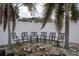 This backyard features a fire pit and a privacy fence at 10754 111Th N Pl, Largo, FL 33778
