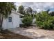 The backyard features a brick paved patio and landscaping at 10754 111Th N Pl, Largo, FL 33778