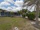 Charming home featuring a well-maintained front yard and tropical landscaping, adding to its curb appeal at 10754 111Th N Pl, Largo, FL 33778