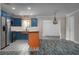 Modern kitchen with stainless steel appliances, white countertops and a copper farmhouse sink at 10754 111Th N Pl, Largo, FL 33778