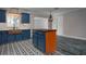 Modern kitchen with stainless steel appliances, white countertops and a copper farmhouse sink at 10754 111Th N Pl, Largo, FL 33778