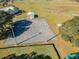 This aerial view showcases the basketball court and surrounding green space at 10814 Brickside Ct, Riverview, FL 33579