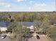 This aerial view showcases the property, complete with mature trees and convenient parking at 10814 Brickside Ct, Riverview, FL 33579