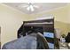 Bedroom features a bunk bed and a gaming chair at 10814 Brickside Ct, Riverview, FL 33579