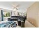 Spacious living room featuring a comfortable sectional sofa and ample natural light at 10814 Brickside Ct, Riverview, FL 33579