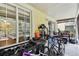 The porch is screened in and has some outdoor furniture with sliding glass door at 10814 Brickside Ct, Riverview, FL 33579