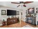 Charming living room features a stone fireplace, a large television, and stylish furnishings, creating a cozy atmosphere at 12162 Aurora Ct, Largo, FL 33774