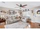 Bright and airy living room featuring comfortable leather furniture, decorative accents, and a welcoming atmosphere at 12162 Aurora Ct, Largo, FL 33774