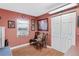 Small cozy room with wood-look floors, natural light and a pair of wooden chairs at 12162 Aurora Ct, Largo, FL 33774
