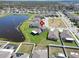 Aerial view showcasing a home's location near a pond, set within a residential community at 13006 Tidal Flats Loop, Riverview, FL 33579