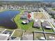 A panoramic aerial view of the home showcasing the large pond, spacious backyard, and neighborhood at 13006 Tidal Flats Loop, Riverview, FL 33579