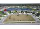High-angle view showcases a home with proximity to community green space and a scenic pond at 13006 Tidal Flats Loop, Riverview, FL 33579