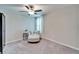 Cozy bedroom area with chair, ottoman, and soft carpet for a relaxing retreat at 13006 Tidal Flats Loop, Riverview, FL 33579