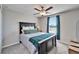 Comfortable bedroom featuring a ceiling fan and a window for natural light at 13006 Tidal Flats Loop, Riverview, FL 33579