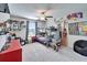 A bedroom with a bunk bed, cartoon-themed decorations, toys, and a red dresser at 13006 Tidal Flats Loop, Riverview, FL 33579