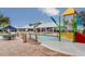Resort-style community pool with splash pad, covered seating, lounge chairs and plenty of space to unwind at 13006 Tidal Flats Loop, Riverview, FL 33579