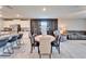 Bright dining area features a modern accent wall, stylish furniture, and an open layout at 13006 Tidal Flats Loop, Riverview, FL 33579
