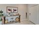 Inviting foyer featuring a decorative console table, stylish decor, and neutral wall colors at 13006 Tidal Flats Loop, Riverview, FL 33579