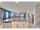This open layout showcases the kitchen's island and how it connects to the living room area at 13006 Tidal Flats Loop, Riverview, FL 33579