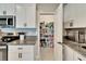 The kitchen provides a great view of the pantry and ample counter space with stainless steel appliances at 13006 Tidal Flats Loop, Riverview, FL 33579