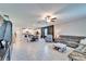 Open concept space featuring living and dining area with view into kitchen island and white cabinetry at 13006 Tidal Flats Loop, Riverview, FL 33579