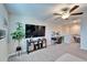 Upstairs living room with a TV, desk, and plenty of space for entertaining at 13006 Tidal Flats Loop, Riverview, FL 33579