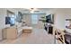 Spacious living room features modern ceiling fan, neutral color scheme, comfortable couch and modern tv at 13006 Tidal Flats Loop, Riverview, FL 33579