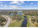 Beautiful waterway with lush greenery, pedestrian bridge and cityscape in the distance at 1301 Melonwood Ave, Clearwater, FL 33759