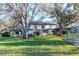 Expansive backyard with mature trees and lush green lawn, perfect for outdoor activities at 1321 N Mcmullen Booth Rd # 1321, Clearwater, FL 33759