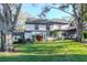 Backyard with green grass and screened porch at 1321 N Mcmullen Booth Rd # 1321, Clearwater, FL 33759
