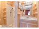 Bathroom featuring walk-in shower and vanity with a sink, mirror and storage shelves at 1321 N Mcmullen Booth Rd # 1321, Clearwater, FL 33759