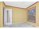 Bedroom with a ceiling fan, window, and a mirror sliding door to the closet at 1321 N Mcmullen Booth Rd # 1321, Clearwater, FL 33759
