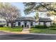 Inviting home exterior with well-manicured landscaping, walkway, and charming architectural details at 1321 N Mcmullen Booth Rd # 1321, Clearwater, FL 33759