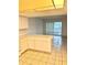 Bright kitchen flows into the living area with access to a patio and an abundance of natural light at 1321 N Mcmullen Booth Rd # 1321, Clearwater, FL 33759