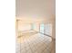 Spacious living area with tiled floors, neutral paint, and sliding doors to an outdoor space at 1321 N Mcmullen Booth Rd # 1321, Clearwater, FL 33759