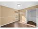 Cozy bedroom featuring wood-look floors, neutral paint, and a closet with shelves at 1410 Wakefield Dr, Brandon, FL 33511