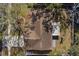 Aerial roof view of a home showcasing its layout and yard with mature trees at 1582 Sandalwood Dr, Dunedin, FL 34698