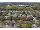 Real estate aerial view showing the location of a home with surrounding neighborhood amenities at 1582 Sandalwood Dr, Dunedin, FL 34698