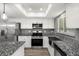 Bright kitchen featuring stainless steel appliances, granite countertops and lots of natural light at 1582 Sandalwood Dr, Dunedin, FL 34698