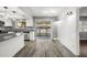 Bright kitchen featuring light countertops and access to the backyard at 1582 Sandalwood Dr, Dunedin, FL 34698