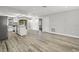 Open floor plan includes hardwood floors and a kitchen with an island for entertaining at 1582 Sandalwood Dr, Dunedin, FL 34698