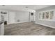 Bright living room featuring light hardwood floors and lots of natural light at 1582 Sandalwood Dr, Dunedin, FL 34698