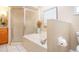 Bathroom featuring a corner shower, soaking tub, and ample vanity space at 1601 E Del Webb Blvd, Sun City Center, FL 33573