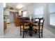 Eat-in kitchen featuring a round dining table and view of cooking and prep area at 1601 E Del Webb Blvd, Sun City Center, FL 33573