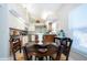 Kitchen features a dining area with a round wooden table and large window at 1601 E Del Webb Blvd, Sun City Center, FL 33573